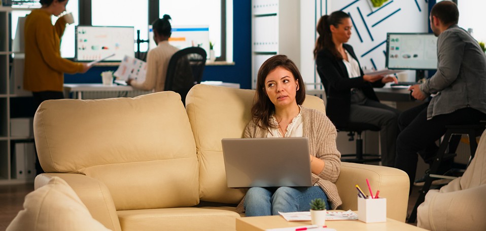 Young employees attending a virtual workplace meeting with cameras on during a Teams call